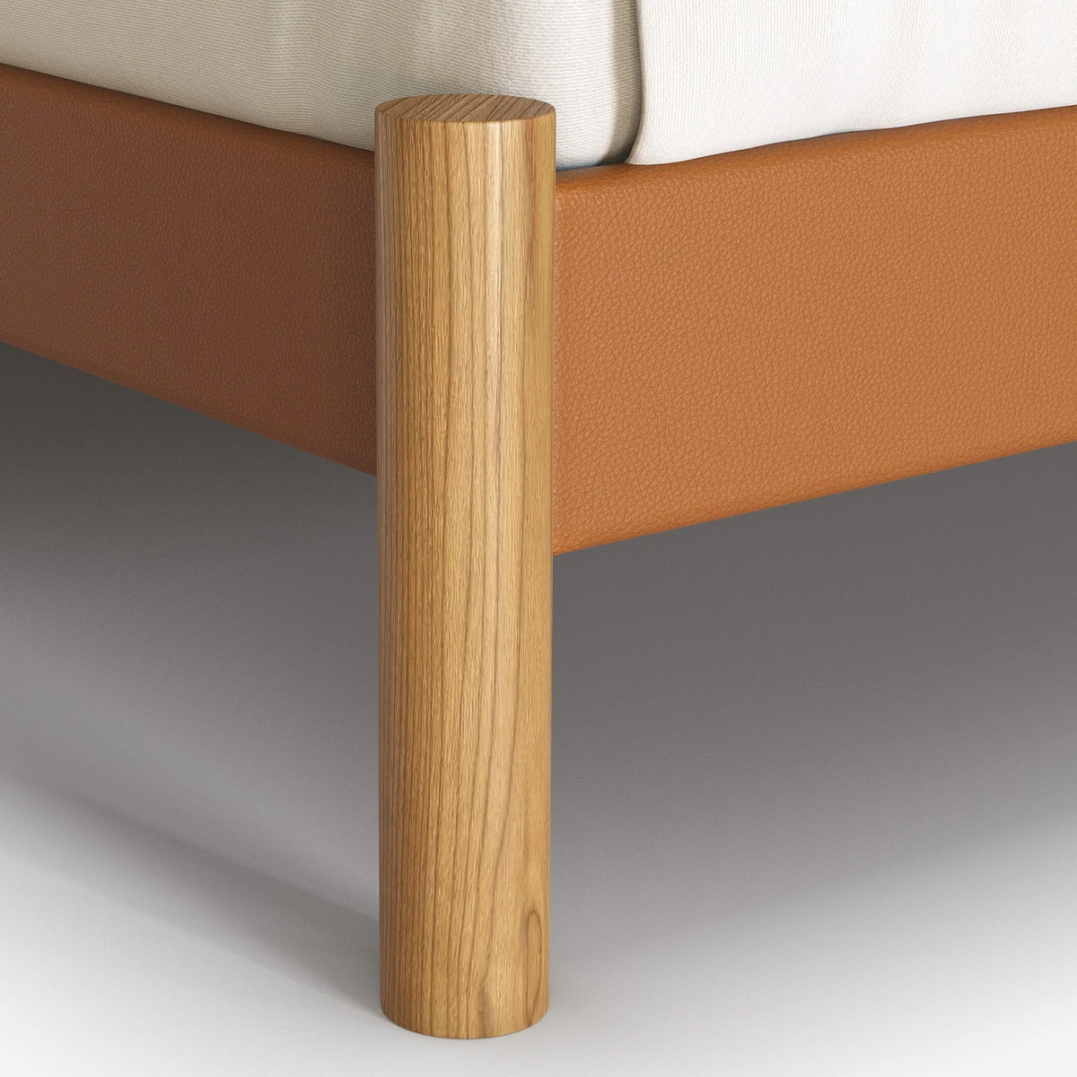 Cozmo Sofas - Cozy Bed - Single - Tan Vegan Leather Frame - Cream Fleece Headboard - Natural Legs - Side angle view