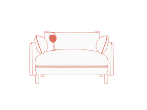 Glass of wine on a Cozmo sofa